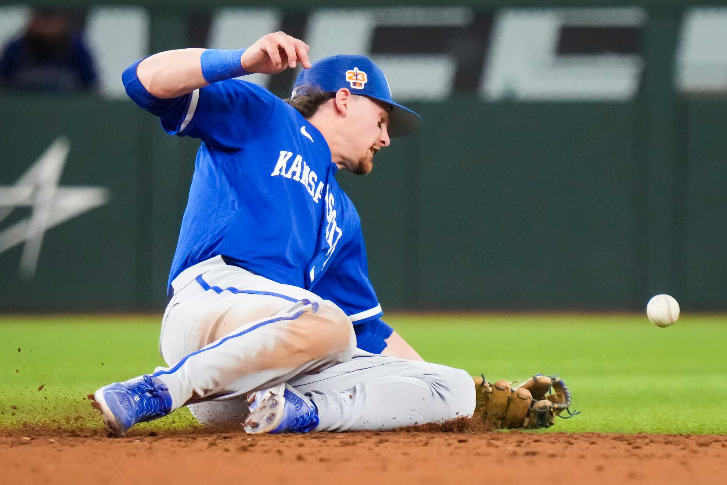 Kansas City Royals shortstop Bobby Witt Jr. (7) can’t make the play on a single off the bat...