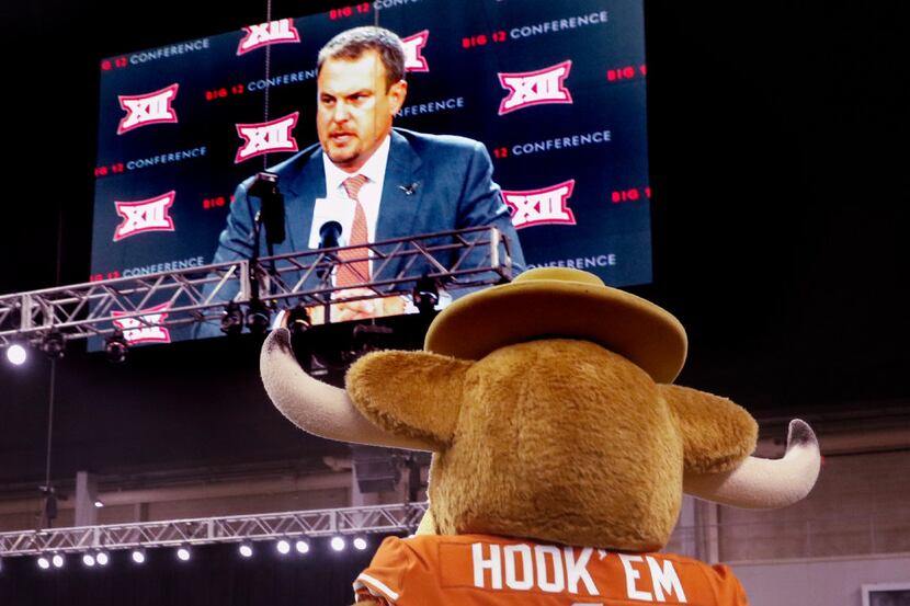 Bevo, the Texas Longhorns mascot, watches Tom Herman, head football coach at Texas as he...