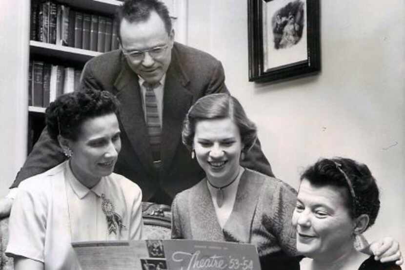 Margo Jones (right) of Theater '54 points out the play scheduled at the theater for March...