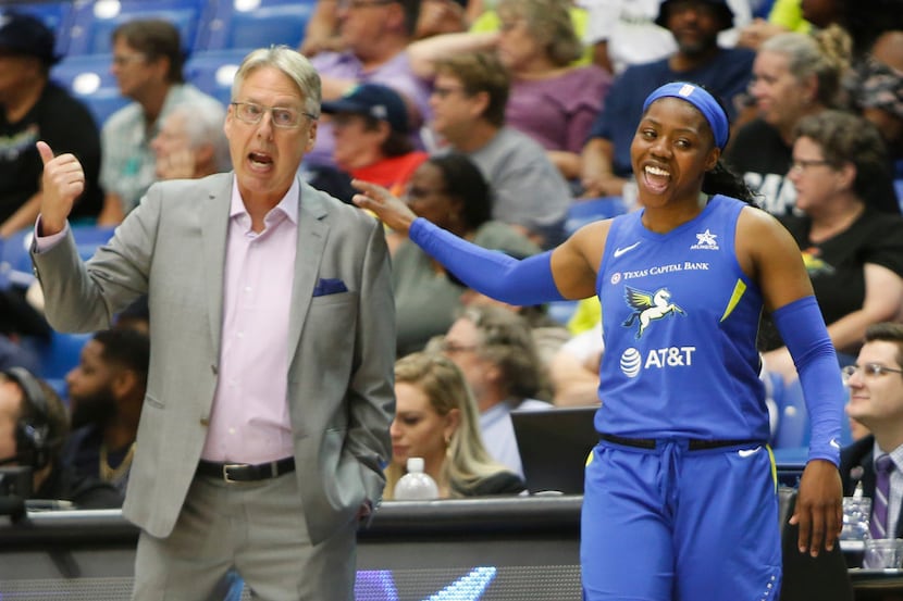 Dallas Wings guard Arike Ogunbowale (24) heads to the team bench after speaking with Wings...