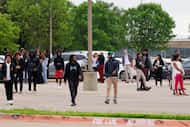 Students stage a walkout outside Wilmer-Hutchins High School, Monday, April 15, 2024, in...