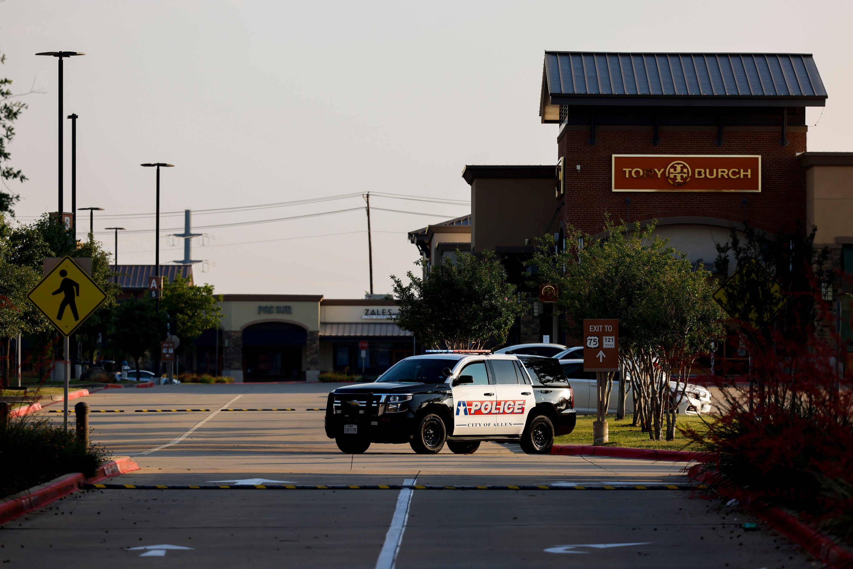 An Allen police department car remains inside the Allen Premium Outlets mall on the day of...