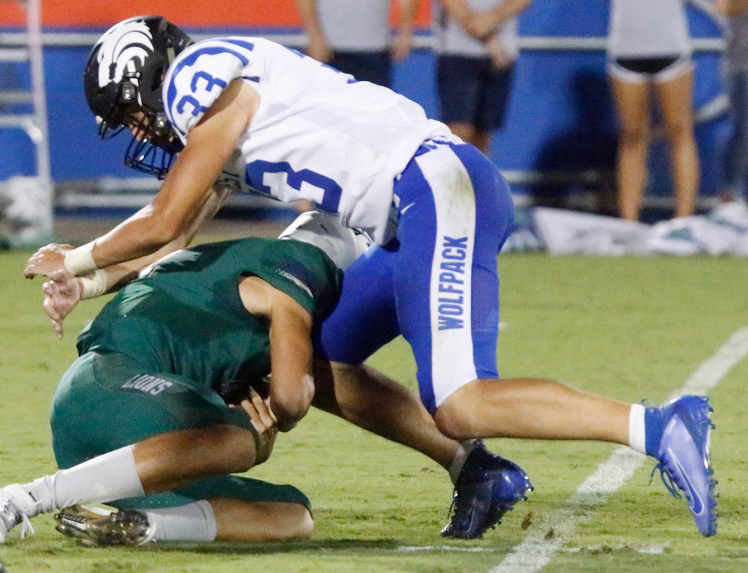 Plano West High School linebacker Cole Olmstead (33) sacks Reedy High School quarterback...