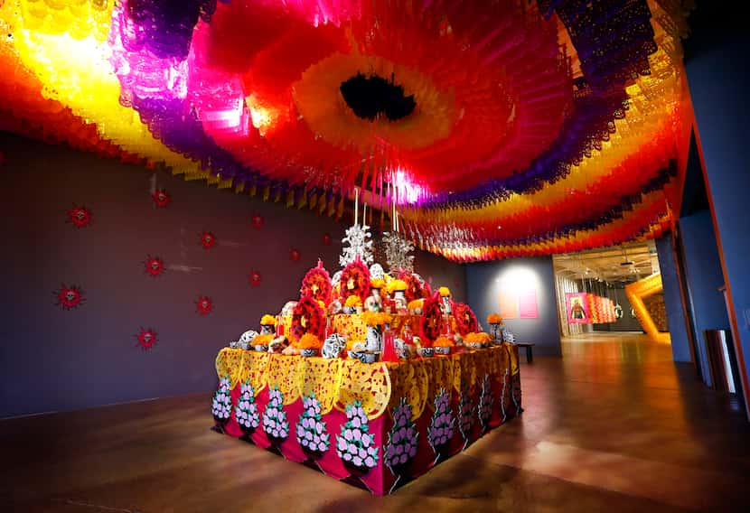 Sugar skulls are presented on a colorful altar as part of Mexican artist Betsabeé Romero's...