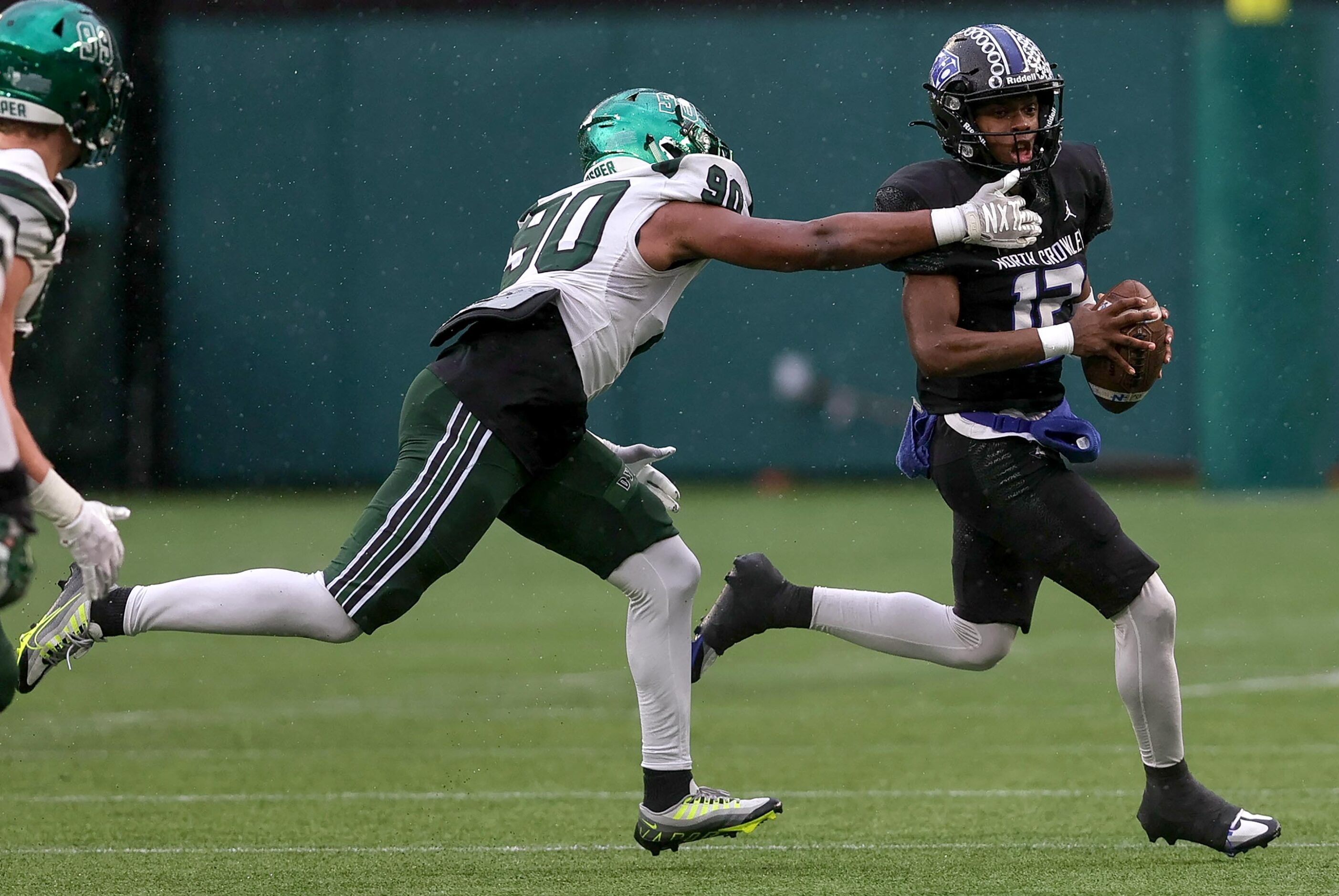 North Crowley quarterback Chris Jimerson (12) tries to avoid getting sacked by Prosper...