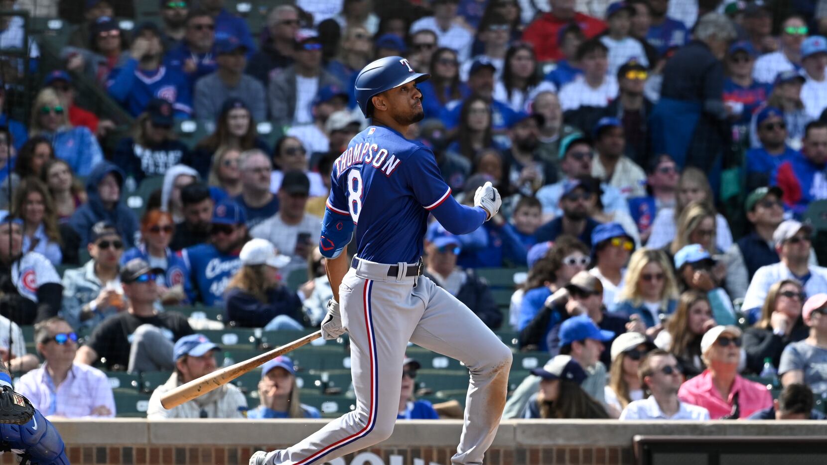 Texas Rangers' Bubba Thompson, hits an RBI triple against the Chicago Cubs during the sixth...