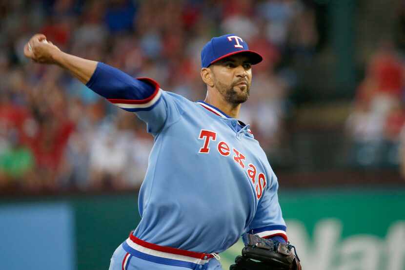Texas Rangers starting pitcher Tyson Ross (44) throws a pitch against Los Angeles Angels...