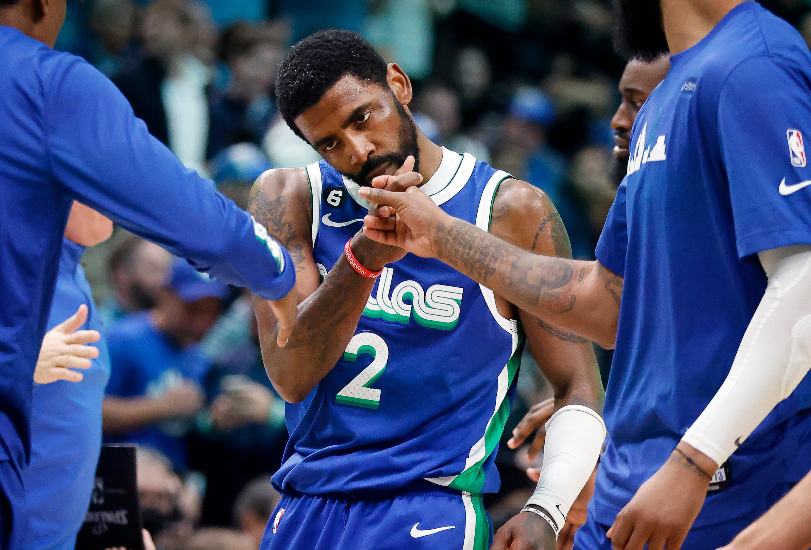 Dallas Mavericks guard Kyrie Irving (2) is congratulated by teammates during a fourth...