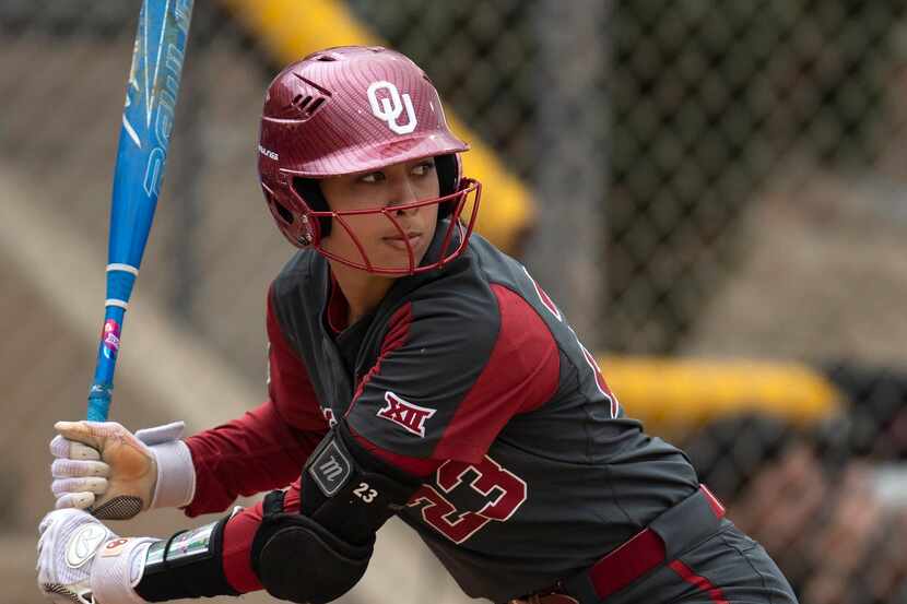 FILE - Oklahoma's Tiare Jennings (23) bats during an NCAA college softball game against...