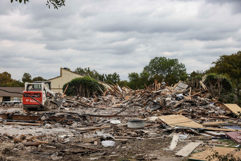 Debris removal work was ongoing in the apartment complex at 5700 Highland Hills in Dallas on...