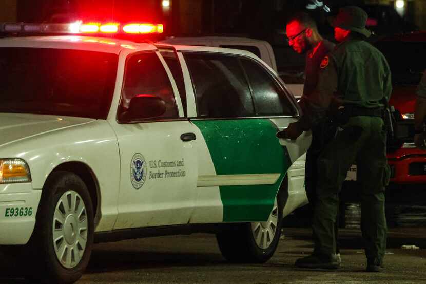 A Border Patrol agent took into custody a person who was transporting a group of...