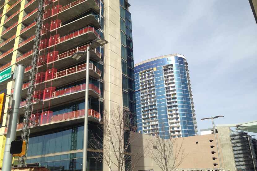 Construction on Legacy West's Windrose Tower condos, on the left, and the LVL 29 apartment...