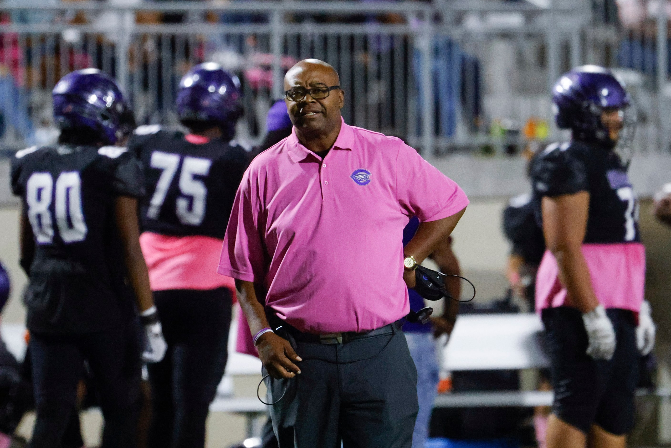 Crowley High head coach Carlos Lynn instructs the team against Trinity High during the first...