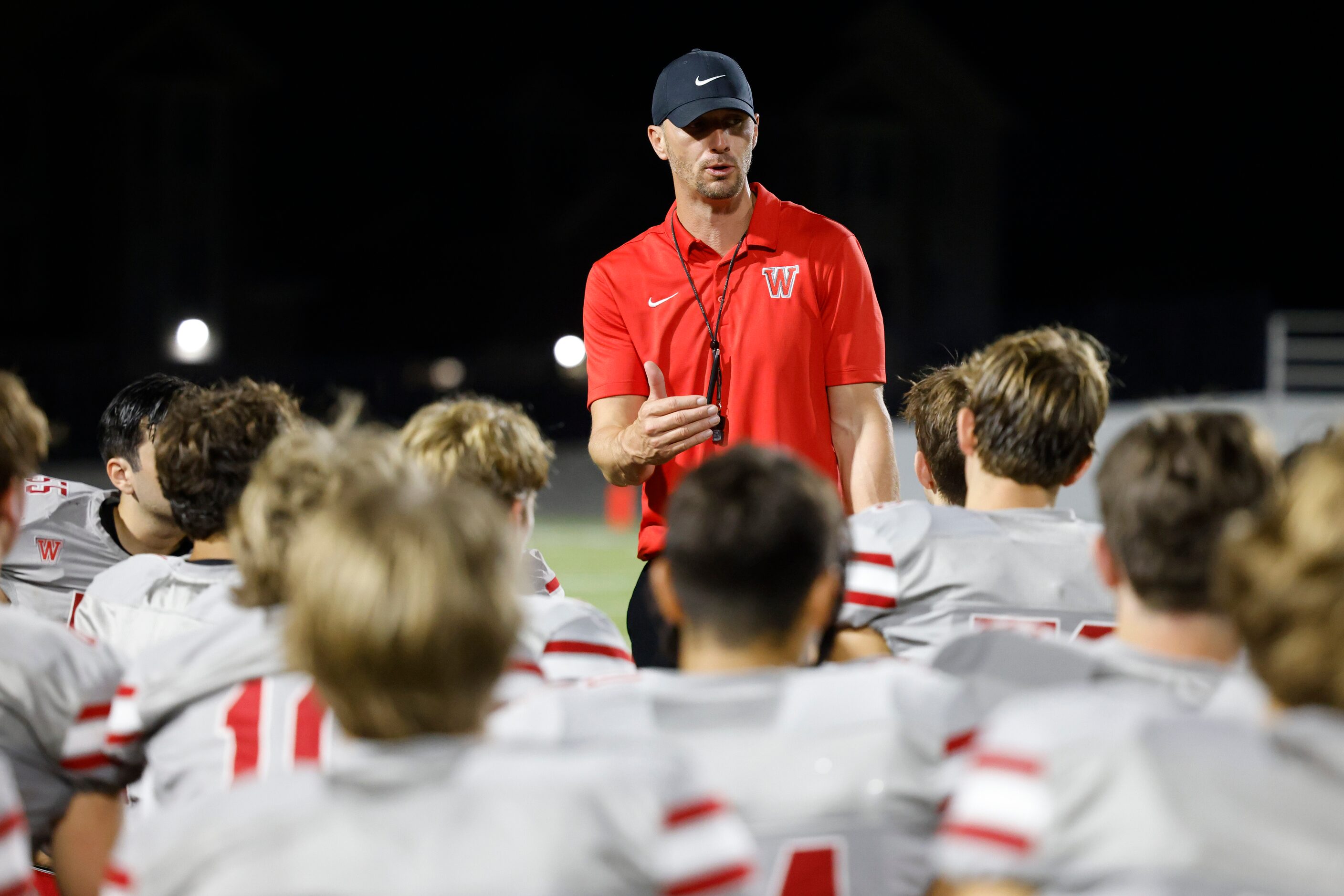 Woodrow Wilson high’s football head coach John Fish
talks towards the players after loosing...