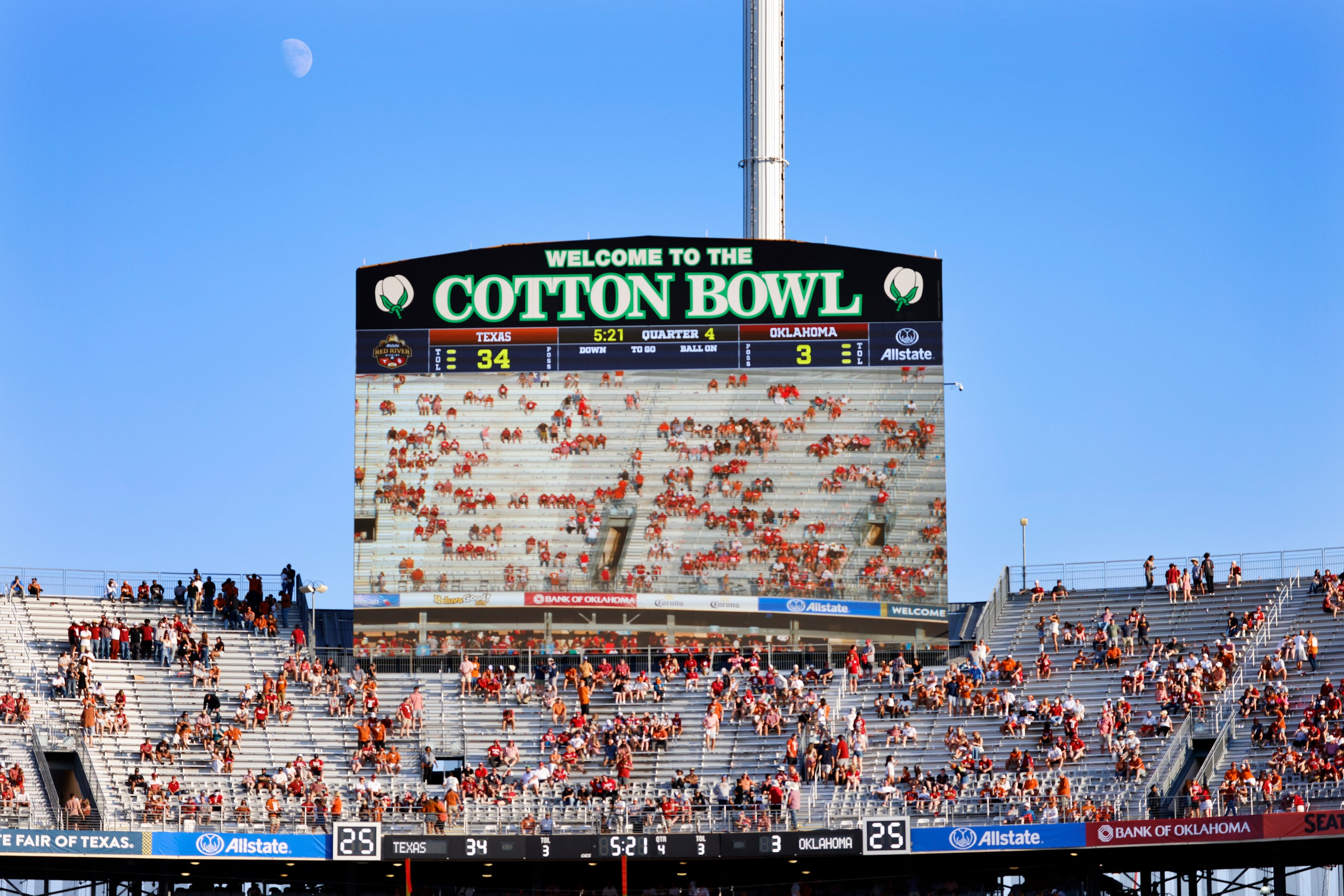 The video board shows an emptying Oklahoma Sooners side of the stadium in the fourth quarter...