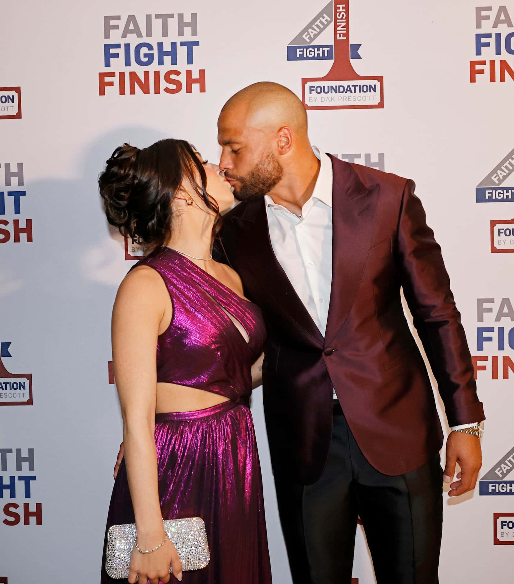 Dallas Cowboys quarterback Dak Prescott kisses his girlfriend Sarah Jane Ramos during the...