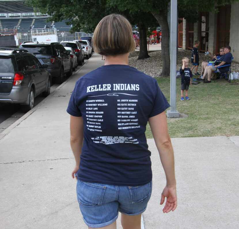 A Keller Indians softball supporter made her way toward the front gate as part of a large...