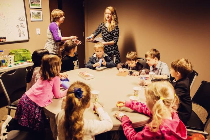 
Stephanie Swain, River of Life Sunday School Director, left, and volunteer Elizabeth...