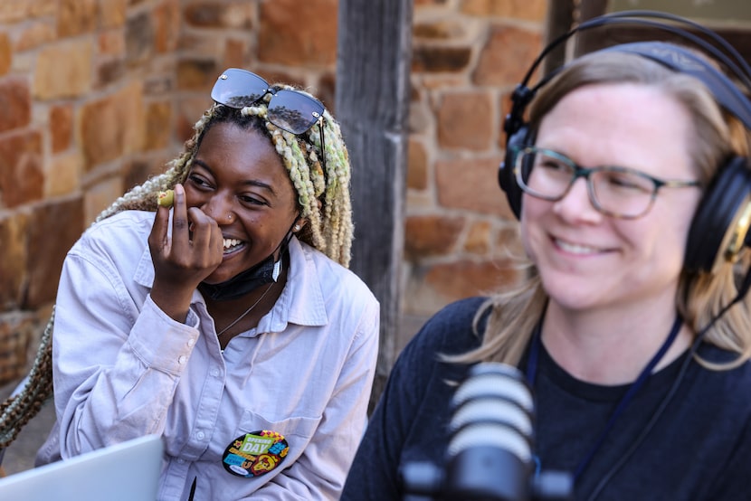 Ariyon Dailey and Erin Booke, both Dallas Morning News staff members, laugh as they chat...