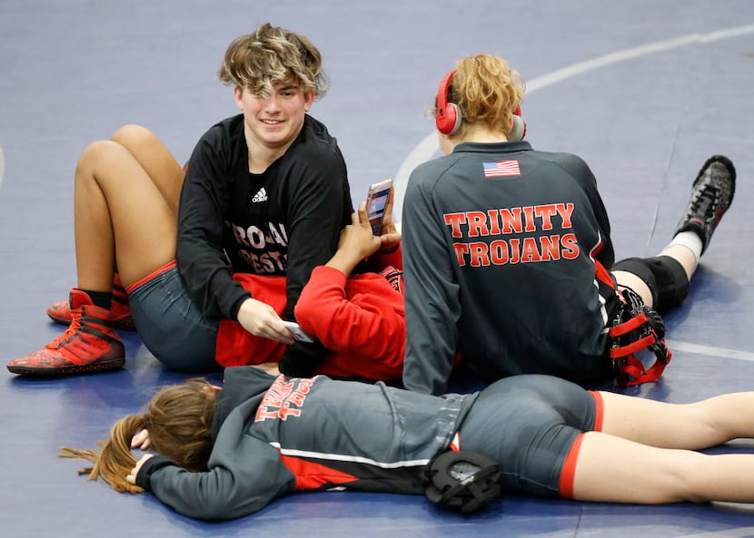 Euless Trinity transgender wrestler Mack Beggs (top, left) hangs out with his female...