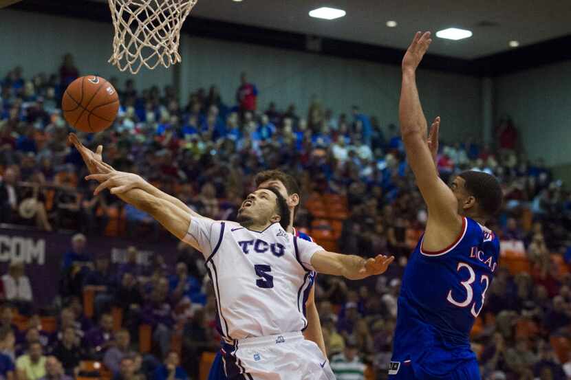 FORT WORTH, TX - JANUARY 28: Kyan Anderson #5 of the TCU Horned Frogs drives to the basket...