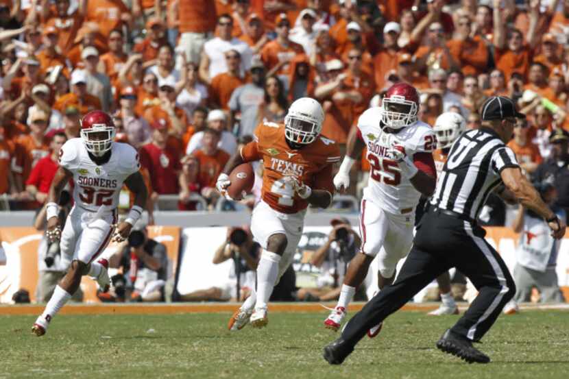 Texas Longhorns running back Daje Johnson returns a punt 85 yards for a touchdown as he is...