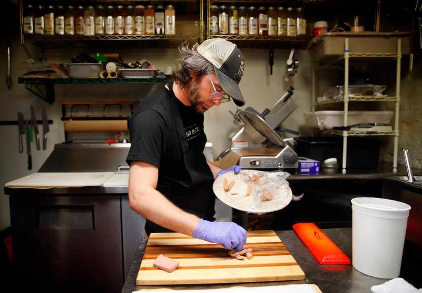 Blind Butcher chef Oliver Sitrin prepares a charcuterie board at the Greenville Avenue...