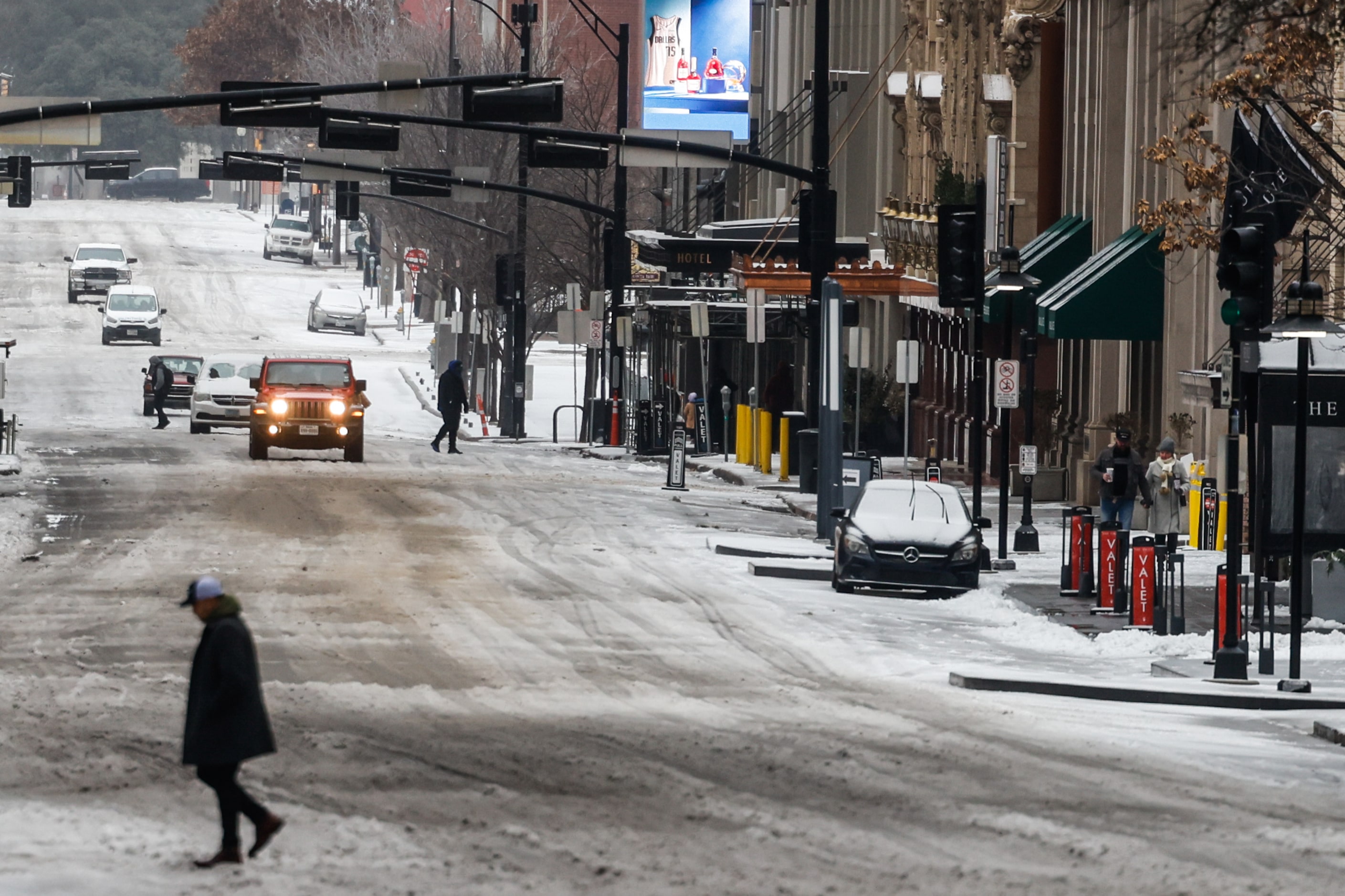 Traffic in downtown Dallas as sleet covered Commerce St on Tuesday, Jan. 31, 2023. Weather...