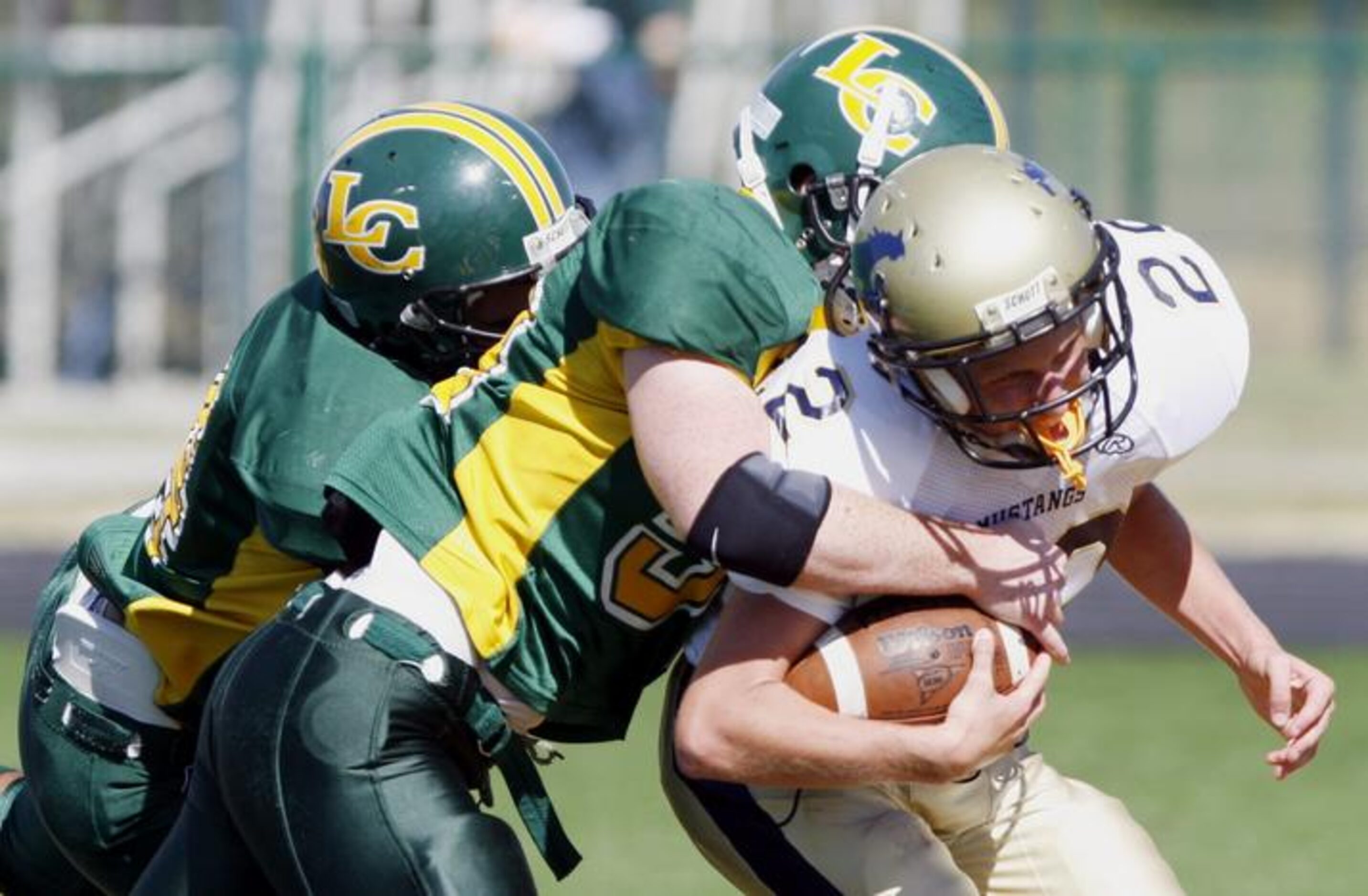 McKinney Christian senior running back Rick Boyle (22) is tackled during a 53-0 loss to...