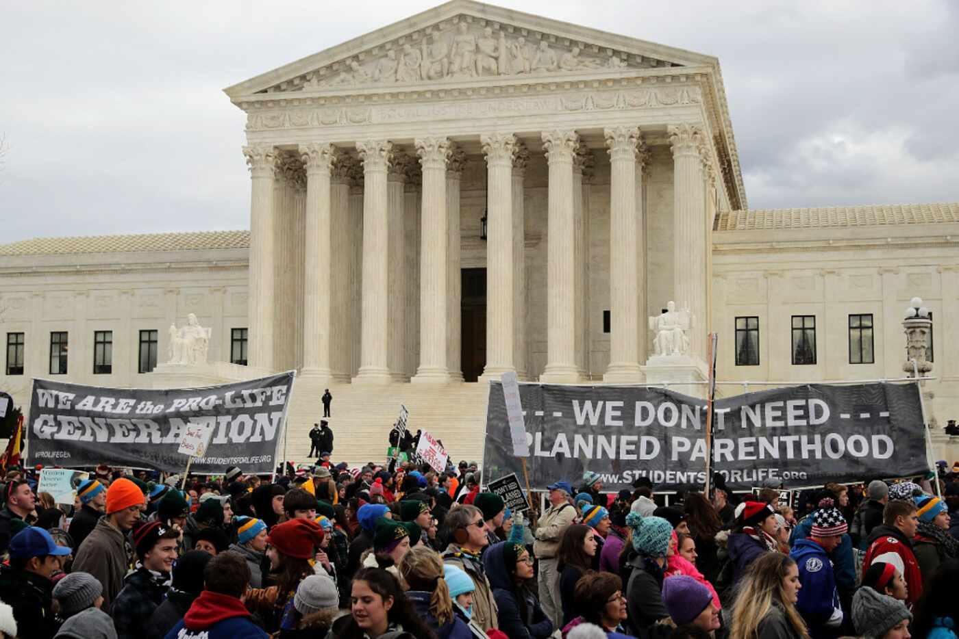 Thousands of anti-abortion protesters walk past the front of the U.S. Supreme Court building...
