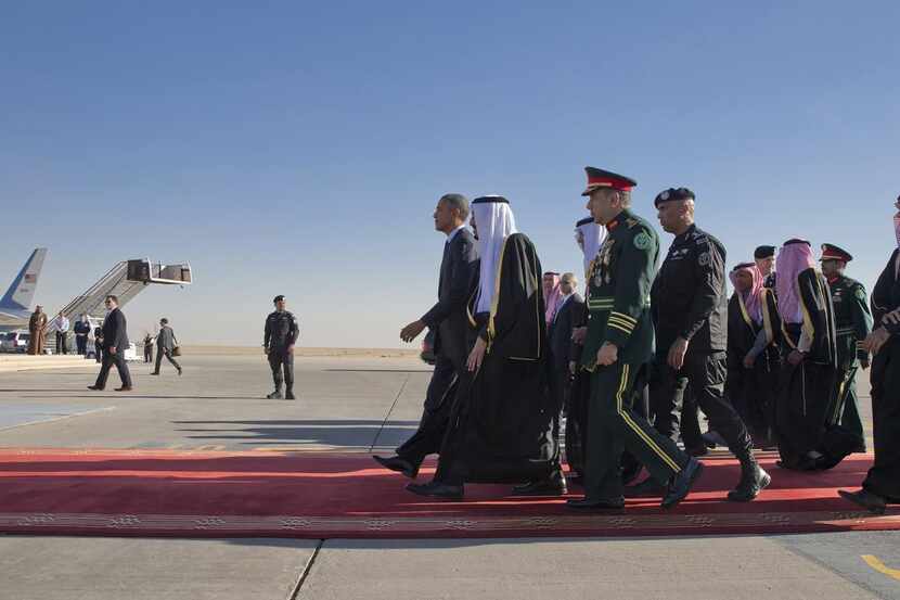 
President Barack and Saudi King Salman bin Abdulaziz Al Saud at the airport after Obama's...