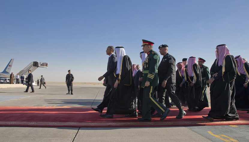 
President Barack and Saudi King Salman bin Abdulaziz Al Saud at the airport after Obama's...