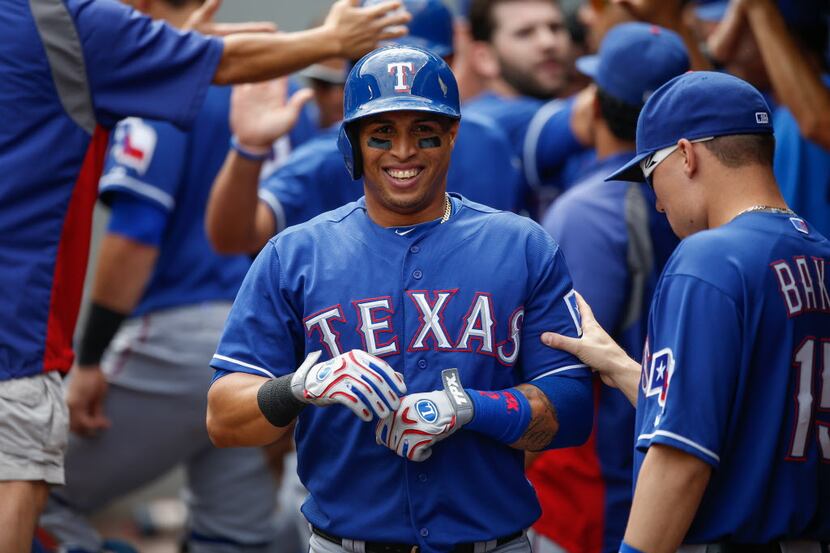 SEATTLE, WA - AUGUST 28: Leonys Martin #2 of the Texas Rangers is congratulated by teammates...