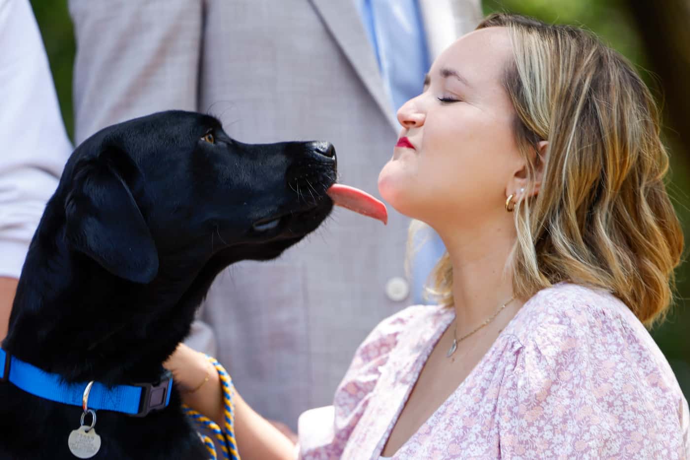 Lauren  Anderson gets a kiss from her dog Thornton in between a portrait session during a...