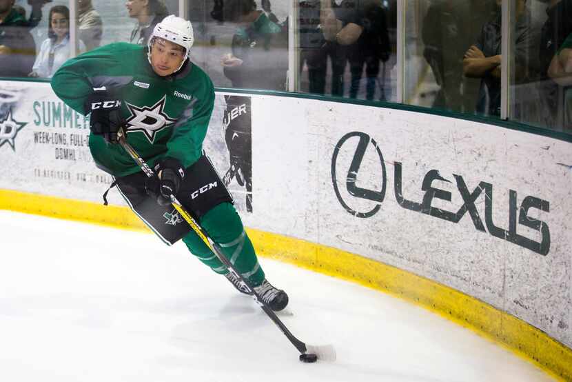 Forward Jason Robertson works along the boards on the first day of Dallas Stars development...