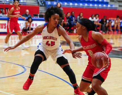 Duncanville's Krislyn Marsh (45) puts pressure on Irving MacArthur's Sarah Andrews during a...