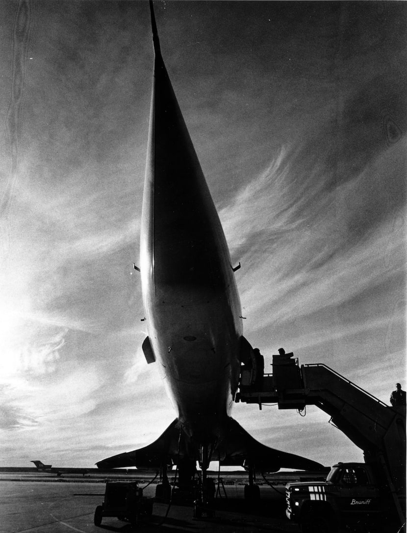 Concorde's nose points toward airport gate as guests board December 10, 1978, on a later...