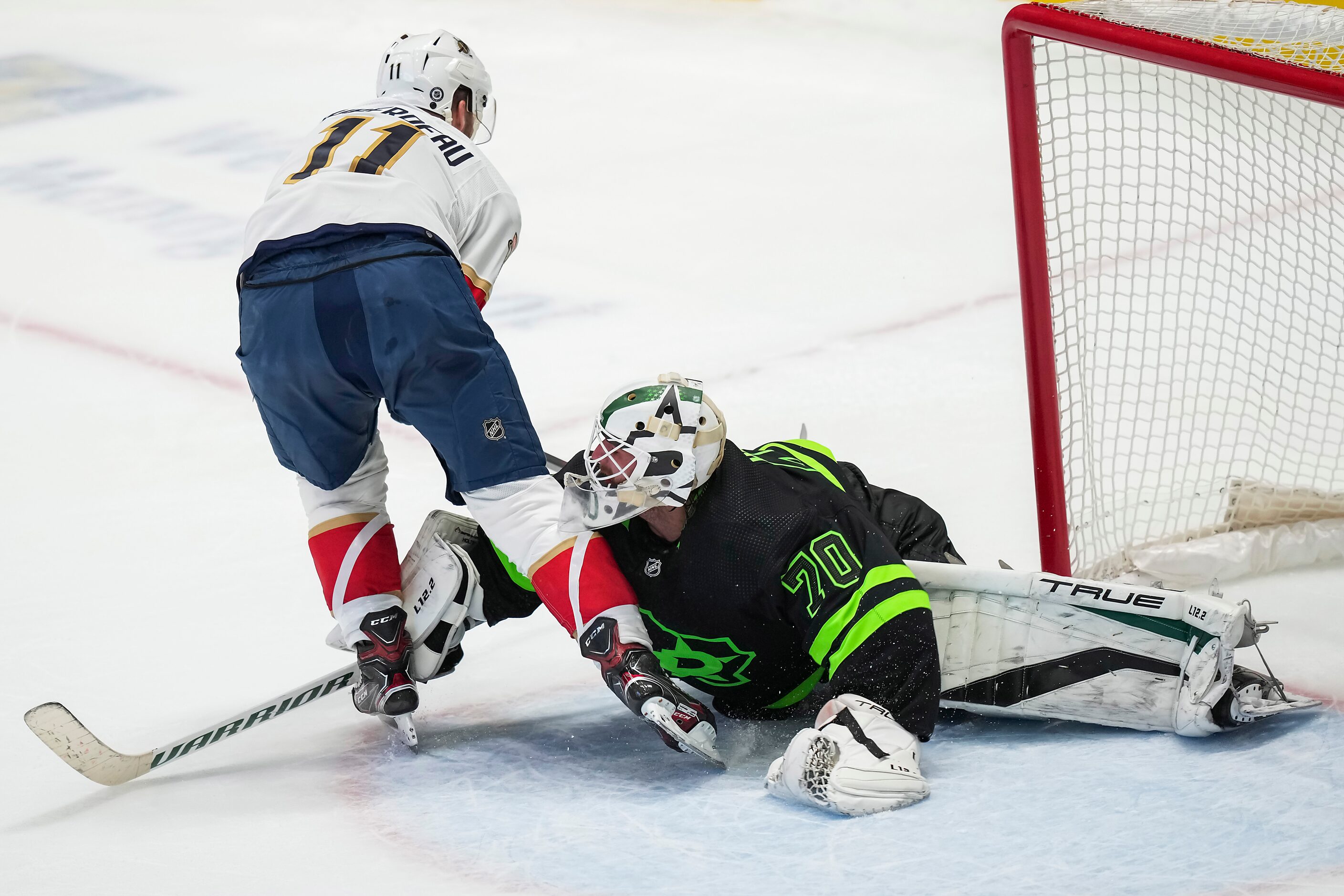 Dallas Stars goaltender Braden Holtby (70) turns away Florida Panthers left wing Jonathan...