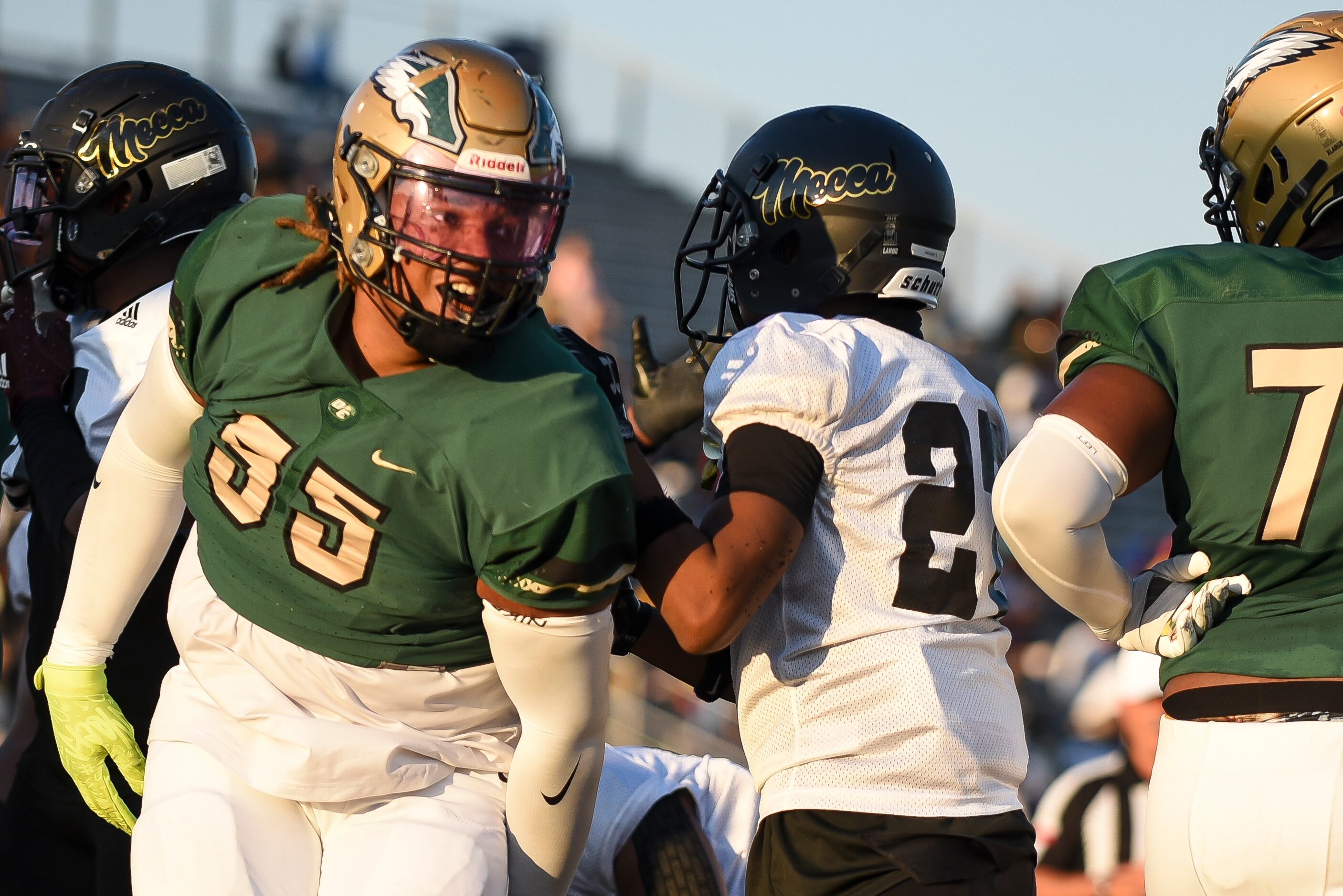 DeSoto senior David Williams (55) celebrates after the Golden Eagles score a touchdown...