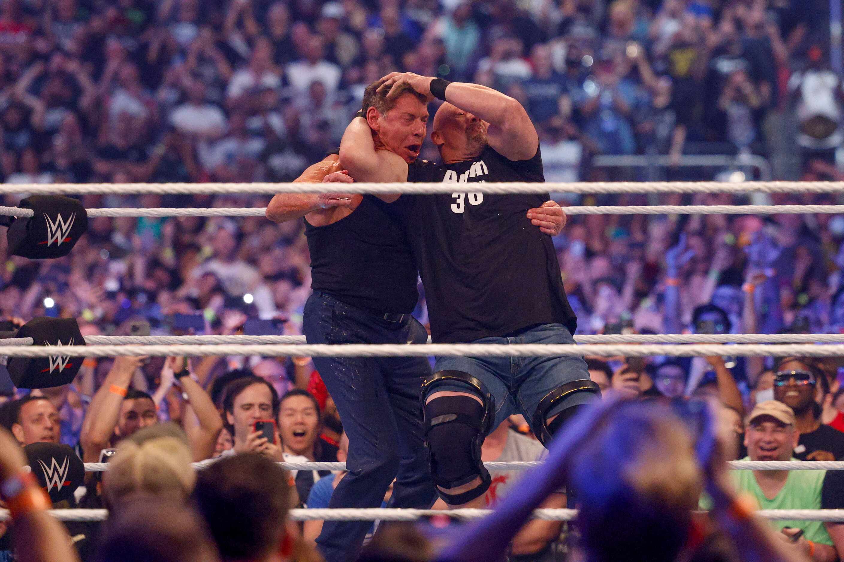 “Stone Cold” Steve Austin hits Vince McMahon with a Stunner during a match at WrestleMania...