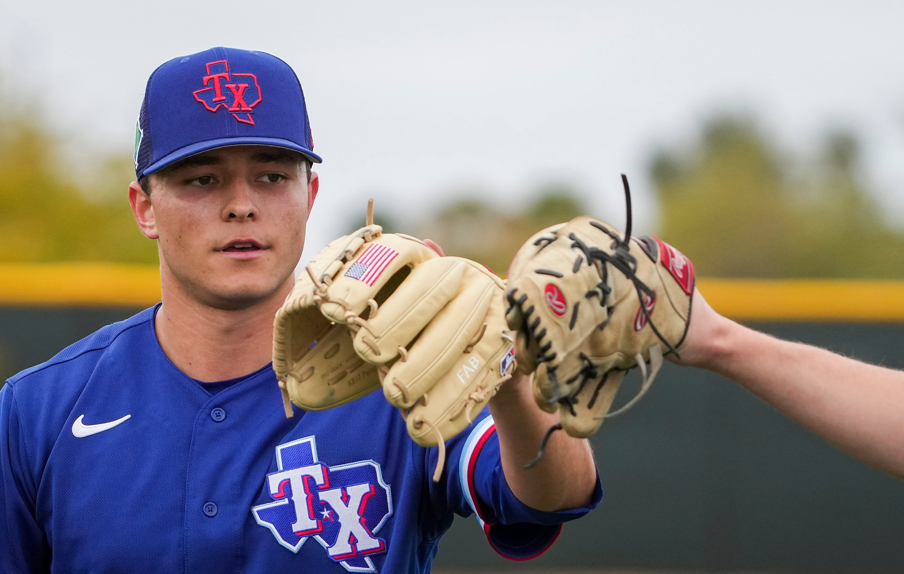 Texas Rangers pitcher Jack Leiter warms up before throwing a bullpen session a during a...