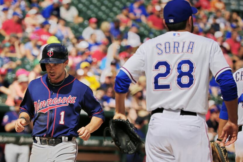 Texas Rangers relief pitcher Joakim Soria (28) looks on as Minnesota Twins center fielder...