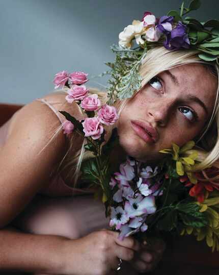 Singer Remy Reilly holding flowers