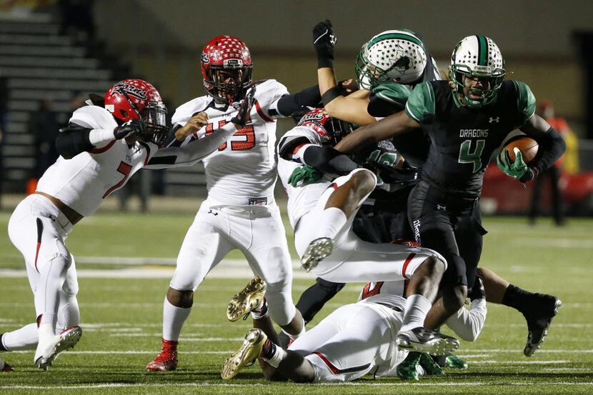 Southlake Carroll running back Lil' Jordan Humphrey moves with the ball in the first quarter...