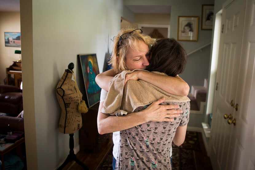 Christy Zartler hugs her daughter Kara at their Richardson home. (Smiley N. Pool/The Dallas...