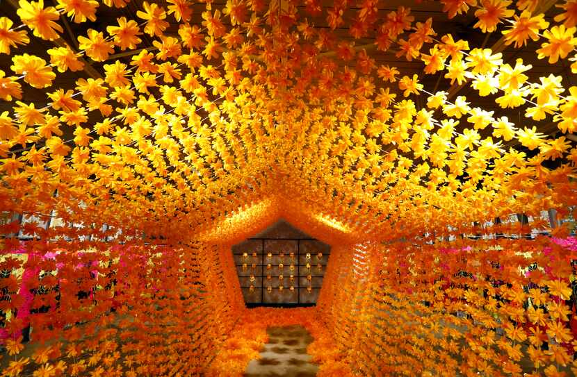 The pentagon-shaped 'Flower Tunnel,' 2019 leads visitors to a tribute to the dead as part of...