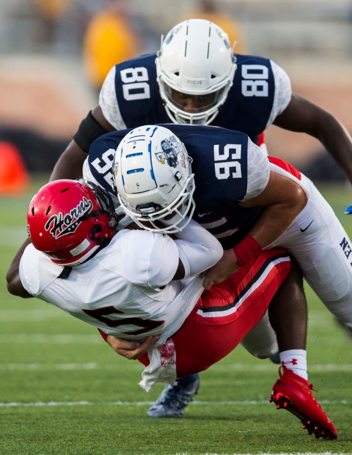 Cedar Hill running back Kevin Young (5) is tackled by Allen defensive lineman Elijah Fisher...