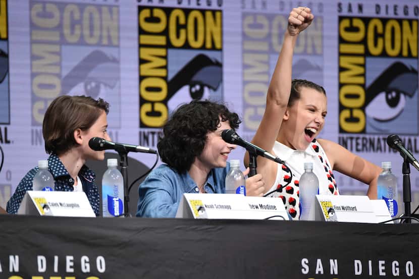 RETRANSMISSION TO CORRECT NAME TO FINN WOLFHARD - Millie Bobby Brown, right, gestures as...