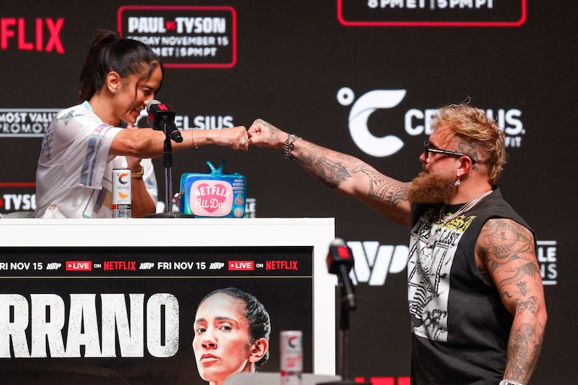 Jake Paul fist bumps Amanda Serrano during a news conference at Toyota Music Factory,...