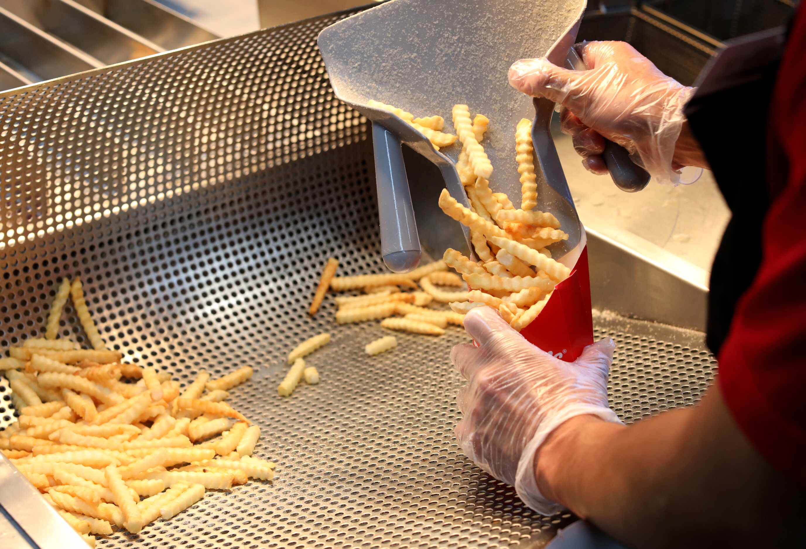 French fry orders are filled as fast as they can be fried at Portillo's in Allen.